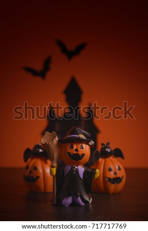Halloween pumpkins jack-o-lantern on orange background. Happy Halloween. 