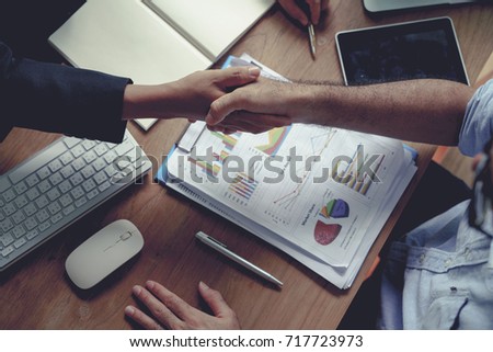 Businessman shake hands agree deal of big lot sales that finish goal of marketing plans of the company
