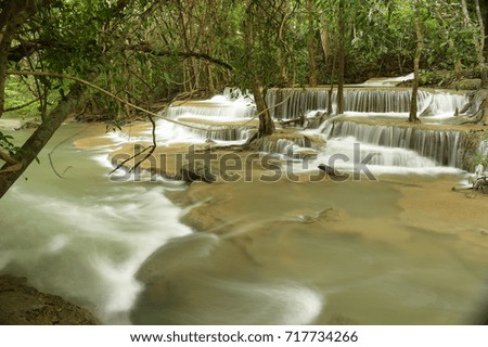 Beautiful waterfall in green forest in nature