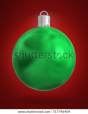 Green Christmas ball isolated on red background.