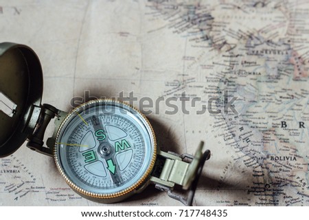 Old compass on vintage map. Retro style