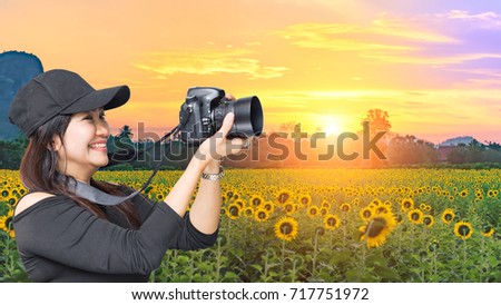 Happy Woman photographed with sunflower