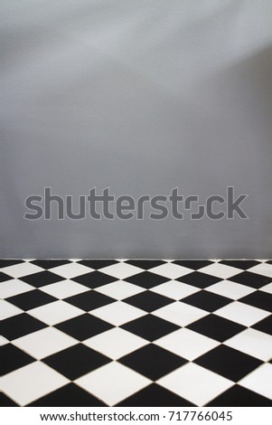 White and black tiles with grey background