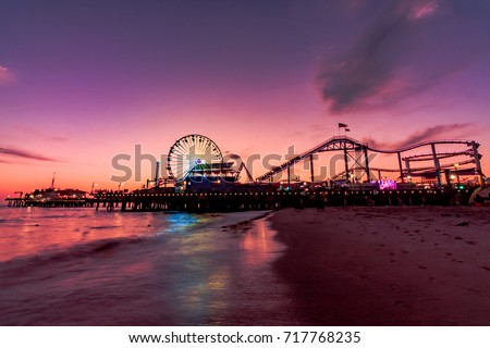 Santa Monica pier at Sunset Royalty-Free Stock Photo #717768235