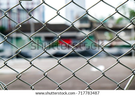 Grid iron netting in outdoor parking lot