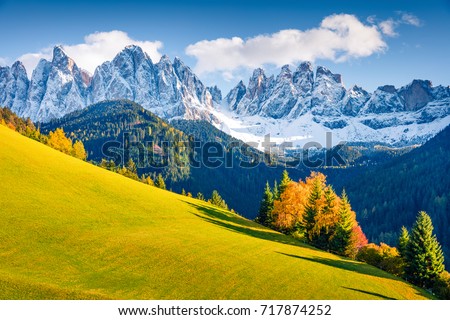 Magnificent view of Santa Magdalena village hills in front of the Geisler or Odle Dolomites Group. Colorful autumn scene of Dolomite Alps, Italy, Europe. Beauty of nature concept background. Royalty-Free Stock Photo #717874252