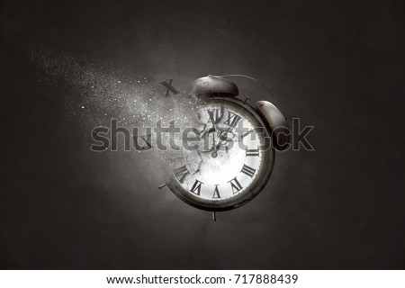 Alarm Clock disintegrates Royalty-Free Stock Photo #717888439