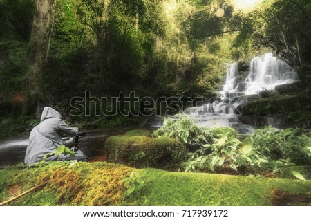 Waterfall with stone , Mundang waterfall , thailand .