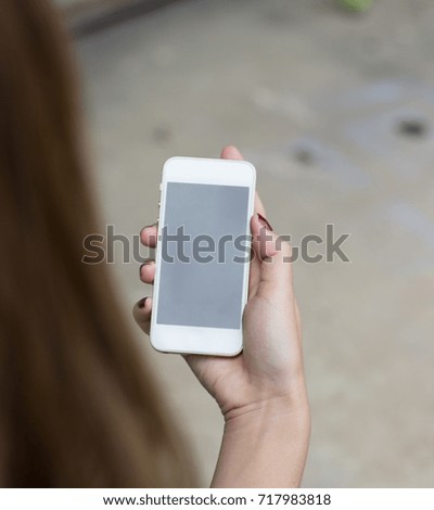 Mockup photo,Hand woman holding smart phone with copy space on screen.