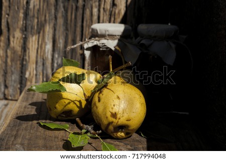 Pear jam and some yellow pears, put on wood table and wooden background