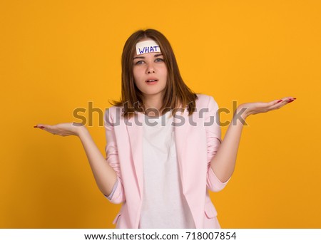 Young cute girl, sticker on a head, studio