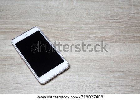 Phone on the wood table , isolated , have copy space