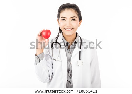 Attractive Happy Asian doctor woman with stethoscope smile and showing red heart for good health,Isolated on white background,Healthcare Concept