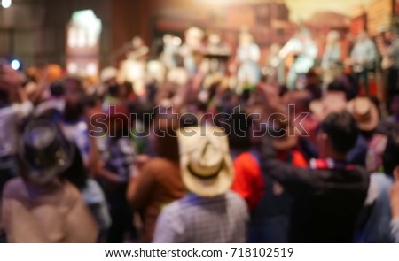 Blurry image in cowboy night party concert.