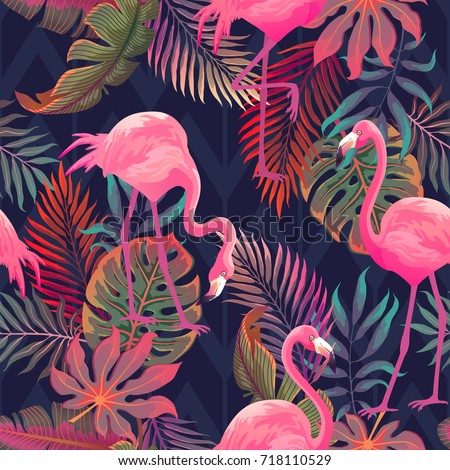 Beautiful seamless vector tropical pattern with pink flamingo and palm leaves on dark background. Abstract summer texture