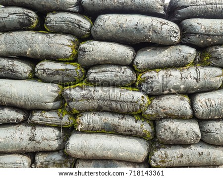 Sandbag bunker of the military base with moss