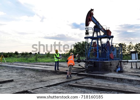 Oil industry engineers at work on an European oil well   