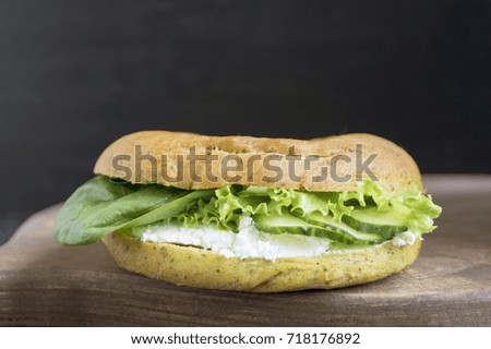 Bun with cucumber, spinach and soft cheese.
