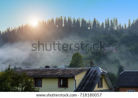 Fog in a mountain village in the forest