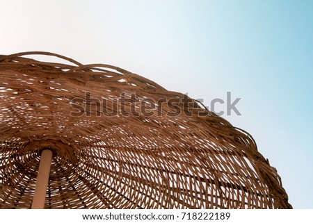 Wicker texture against the blue sky
