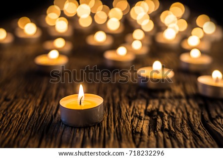 Christmas candles burning at night.  Royalty-Free Stock Photo #718232296