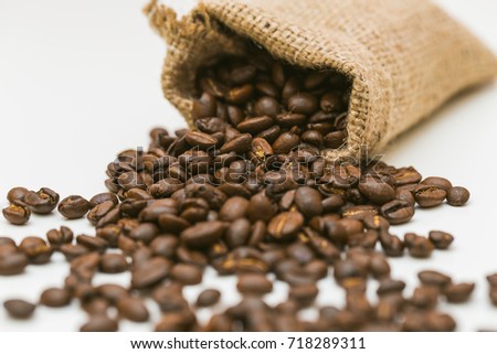 Coffee beans in a bag on a white background