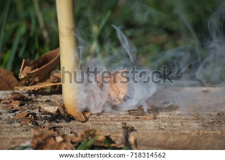 Generate fire with friction Royalty-Free Stock Photo #718314562