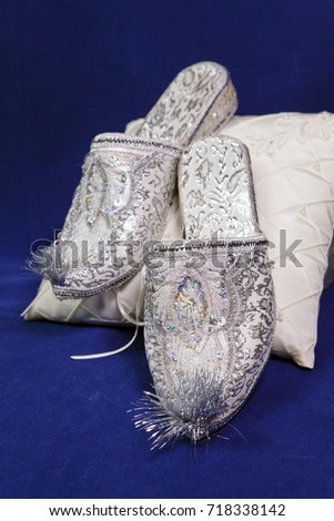 east style bride wedding shoes on a blue velvet