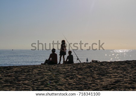 Photo of fishermen fishing on a sea bank.