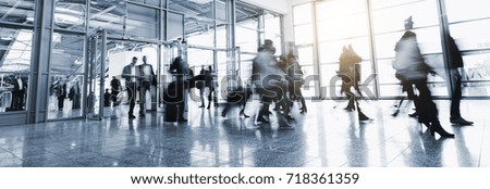 Anonymous people commuting walking in a corridor