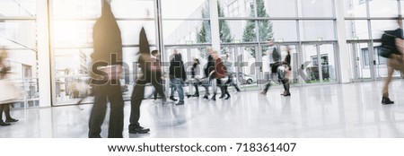 Anonymous Crowd of business people at a corridor