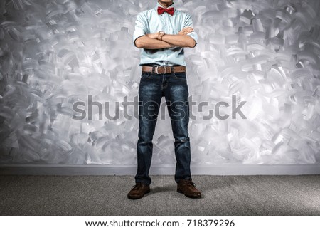 Vintage men clothing retro style with low key lighting over loft concrete wall background.