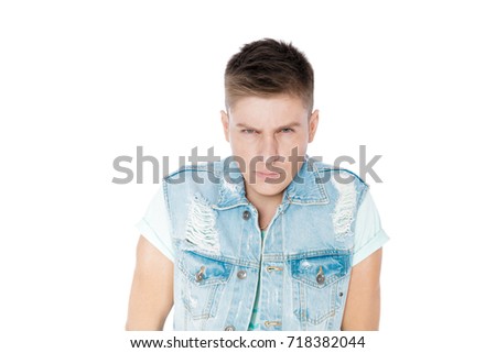 handsome serious young man in denim isolated white background