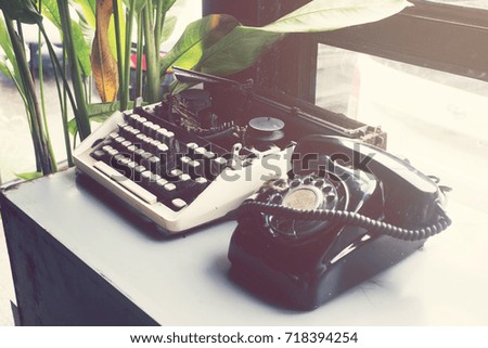 Old:retro typewriter and telephone