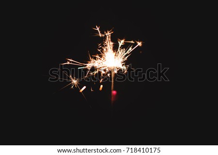 Sparkler firework light glowing in the dark