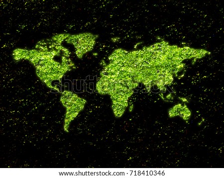 Green moss in shape of world map on black background