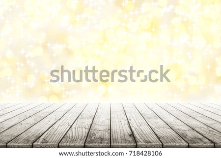 Empty wooden table with shining stars and golden bokeh background blurred. Concept celebration, happy, romantic, gift, valentines