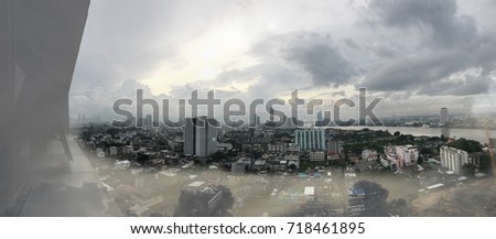 Double layer cloudy and top view city with center focus background.