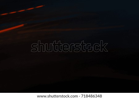 Abstract motion blur of multicolor night light on a black background.