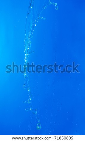 beautiful water splash on blue gradient background
