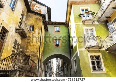 Architecture of the Medieval Piedmont City of Cuneo in Italy. Vintage Italian lamps and balconies in Mediterranean style