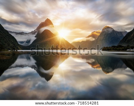 Beautiful sunrise in Milford Sound, New Zealand. - Mitre Peak is the iconic landmark of Milford Sound in Fiordland National Park, South Island of New Zealand.