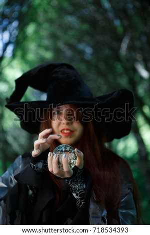 Photo of witch with magic ball