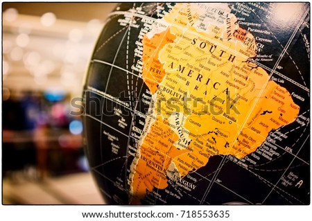 South America Map on a Vintage Globe Royalty-Free Stock Photo #718553635