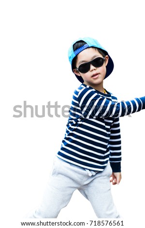 Portrait of young boy wearing blue cap and sunglasses isolated on white background