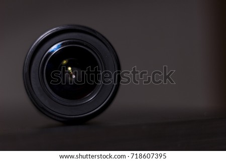 The lens on a blurred background under the light of the lamps.