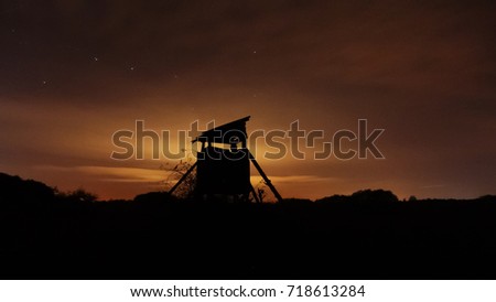 Hunting tower silhouette at night