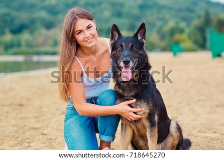 Girl with a dog in the park