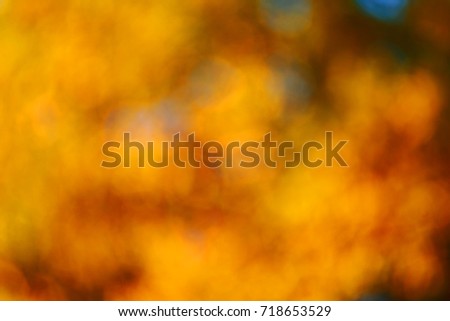 Abstract, colorful, blurred (unfocused) background with spin(color of yellow, green, red). Season of Autumn (Fall). Natural bokeh.
