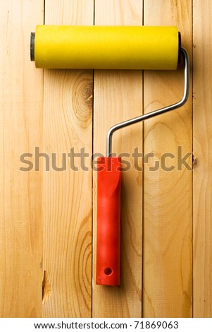 Roller isolated on wooden background